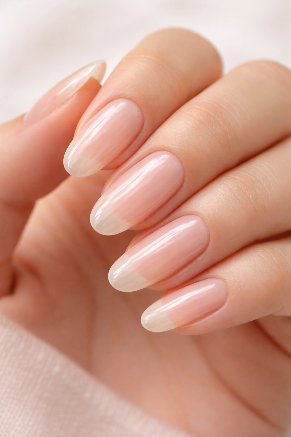 Natural nails with clear gloss on oval shape