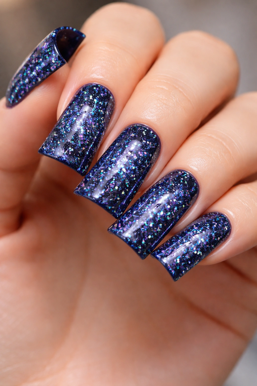 Navy blue duck nails with iridescent holographic glitter