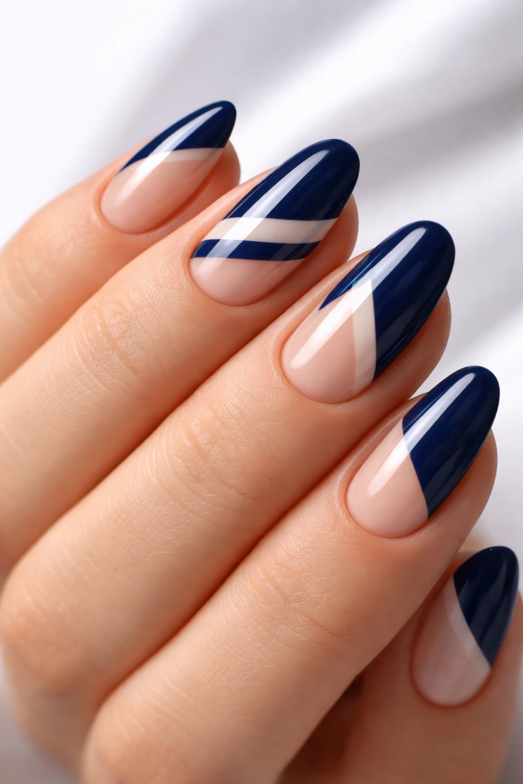 Navy nails with negative space geometric design