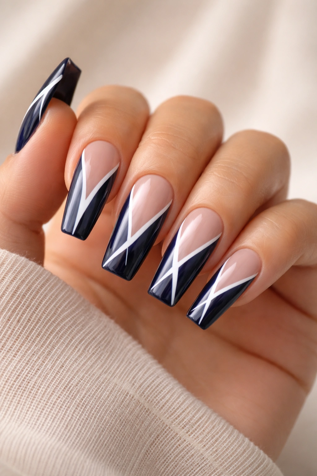 Navy blue coffin nails with white negative-space designs