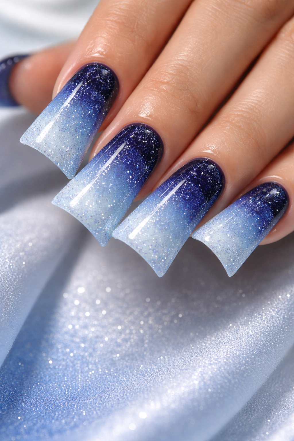 Navy to powder blue ombre nails with fine glitter