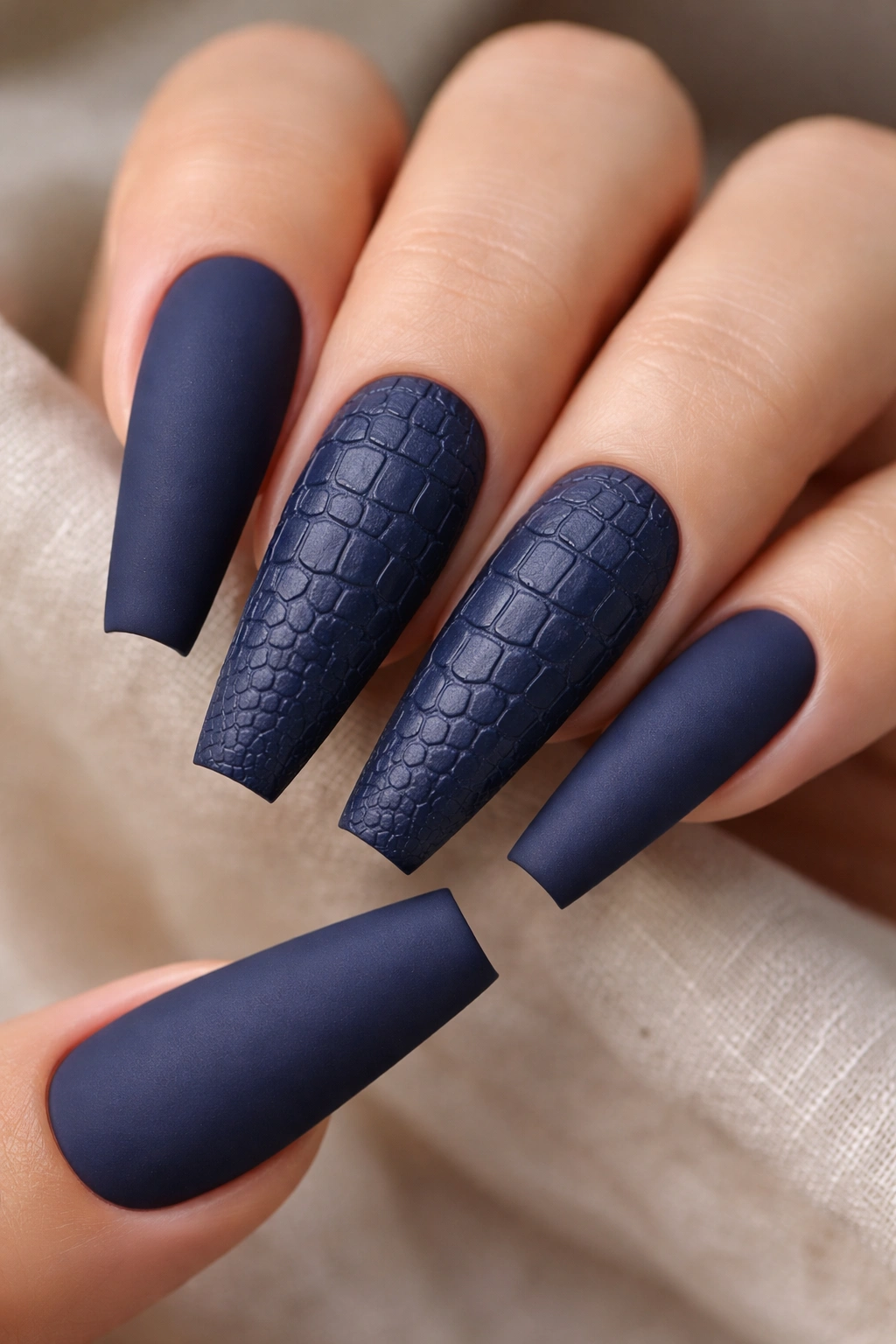 Navy matte nails with crocodile texture on accented nails