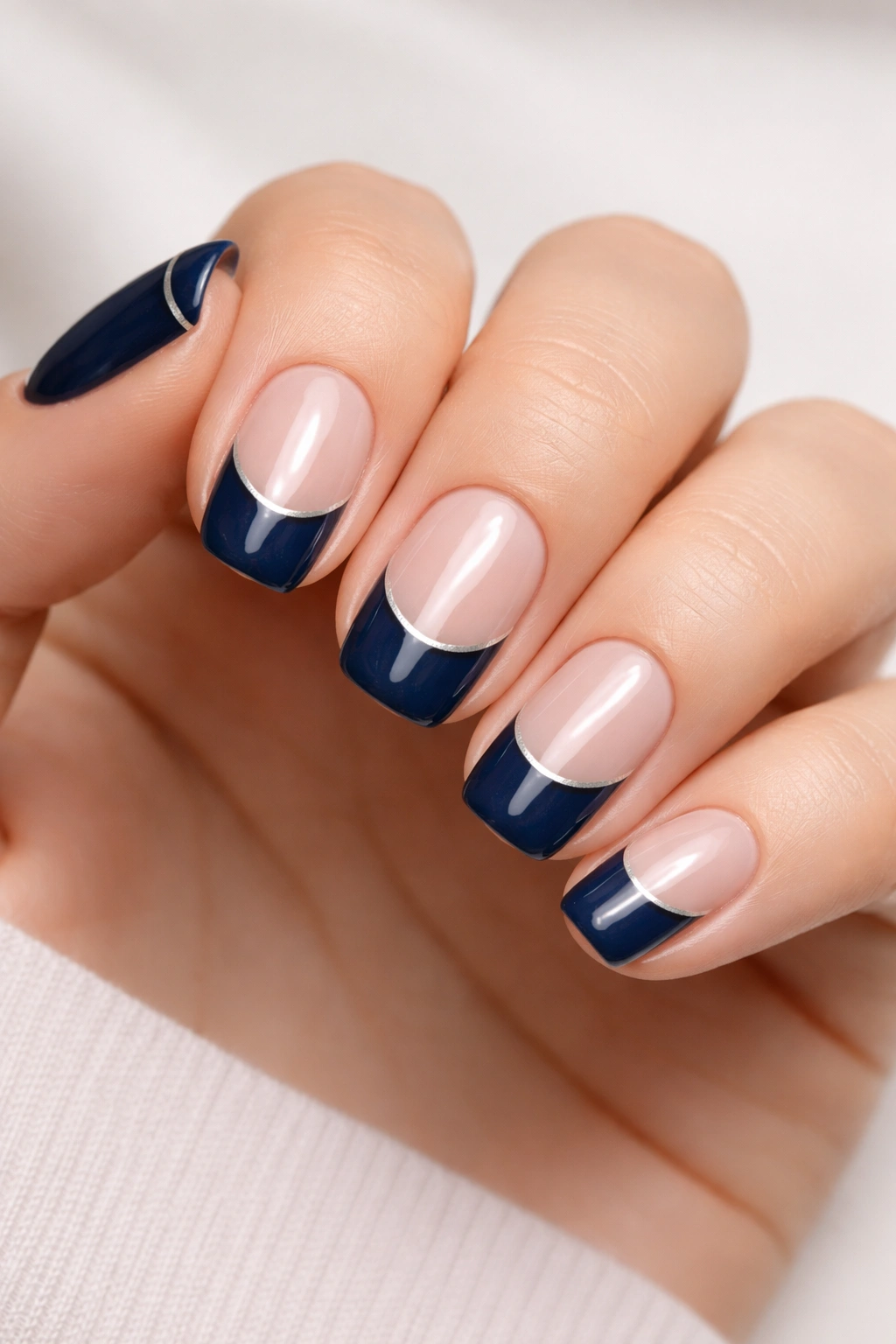 Navy blue nails with negative space French tip on squoval nails