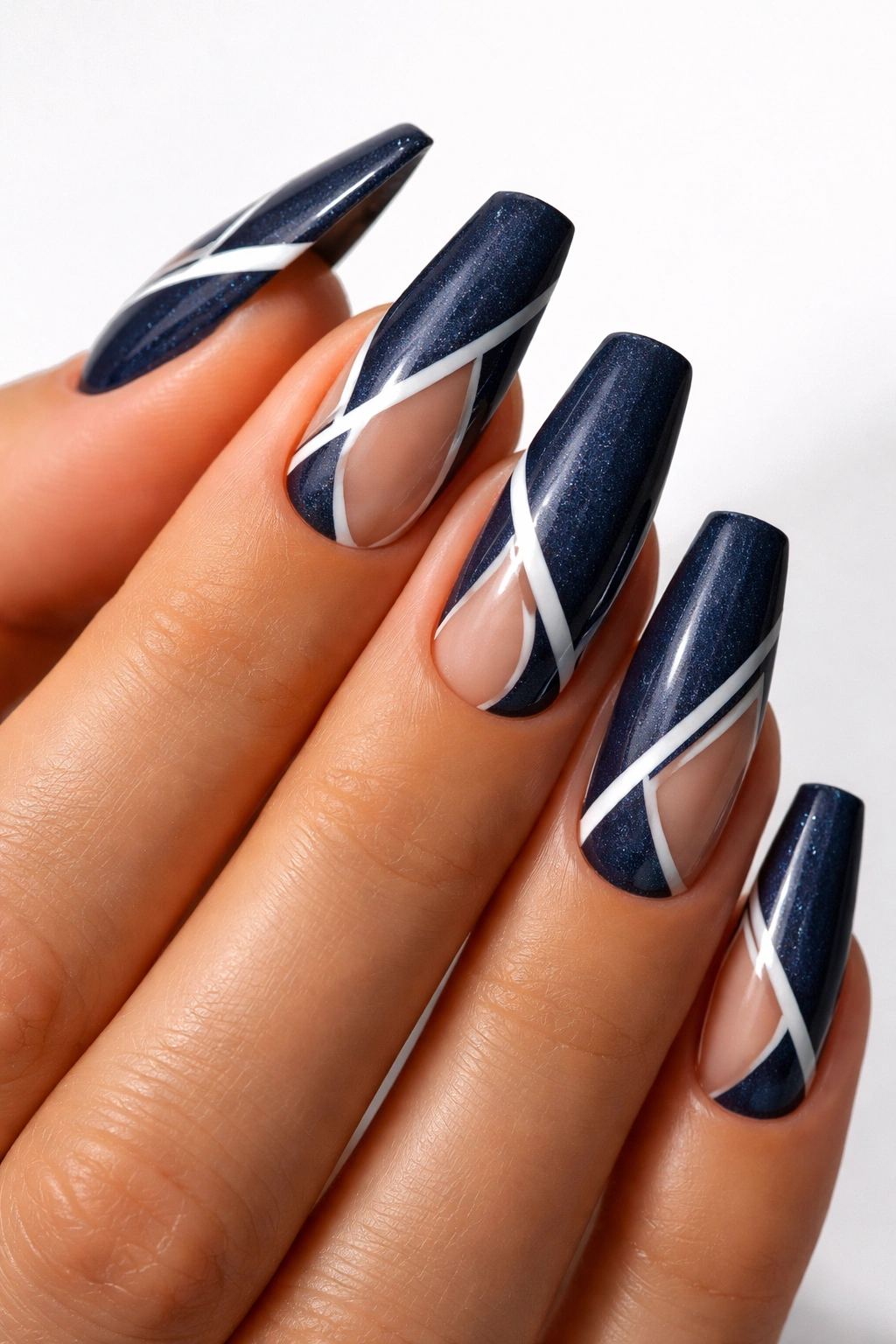 Deep navy coffin nails with white negative space design