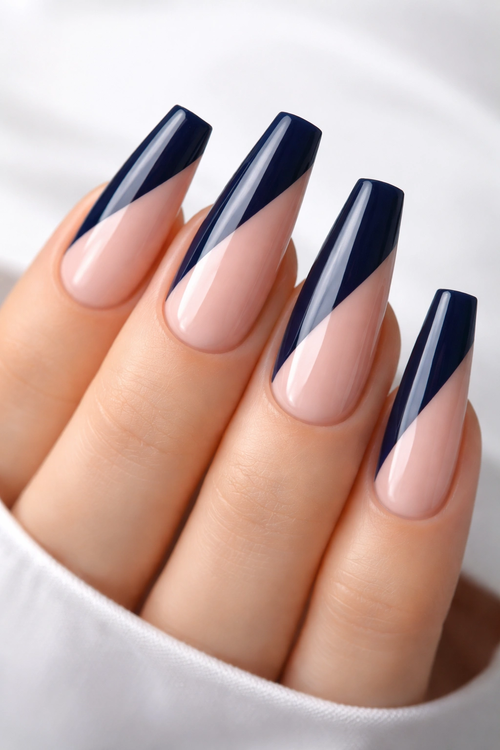 Navy and nude diagonal split on ballerina nails
