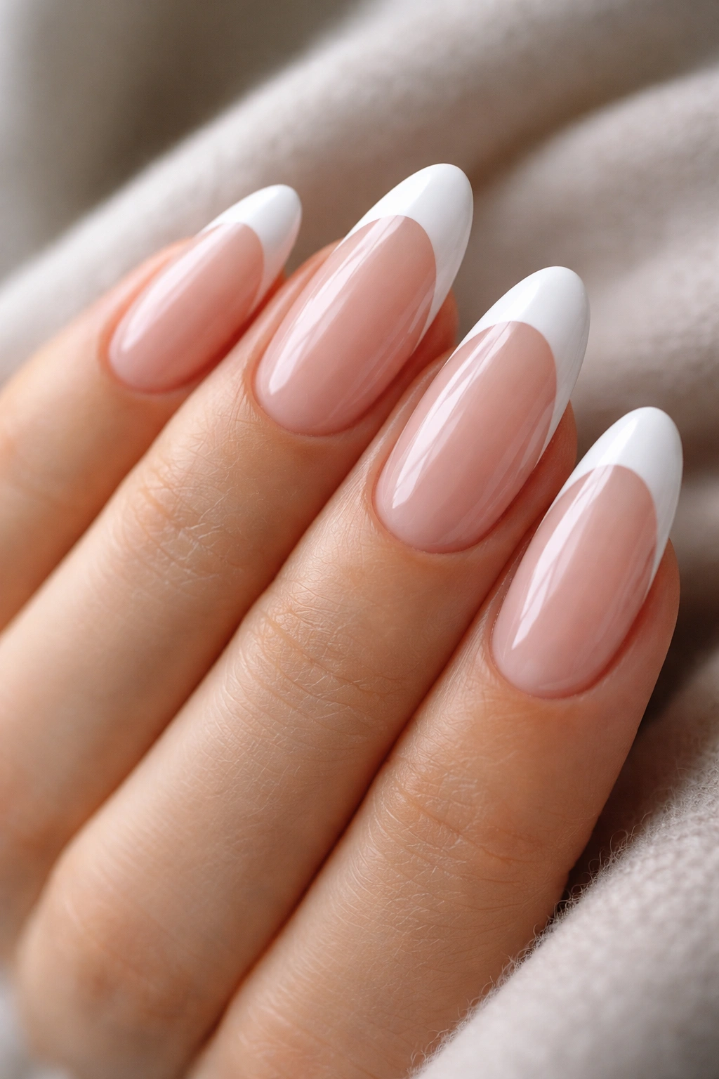 Long oval nails with neat, glossy top coat and smooth edges