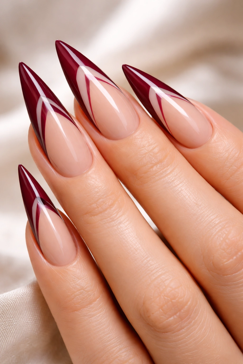 Burgundy tips with negative space cutouts
