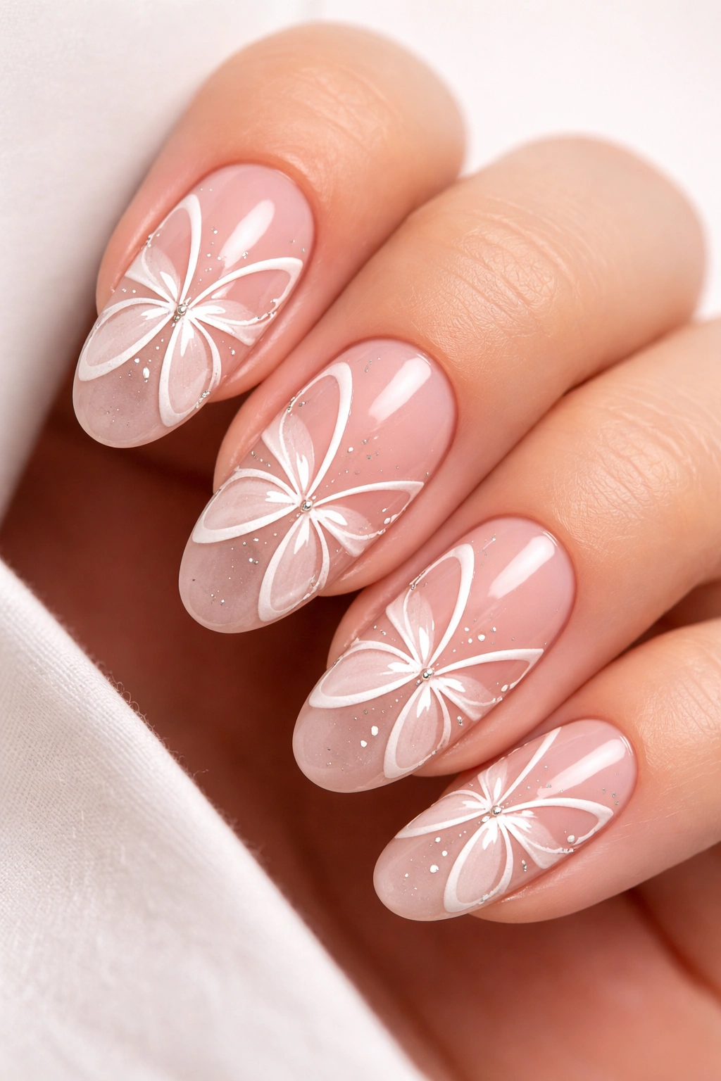Macro close-up of nails with negative-space butterfly shapes formed by unpainted areas