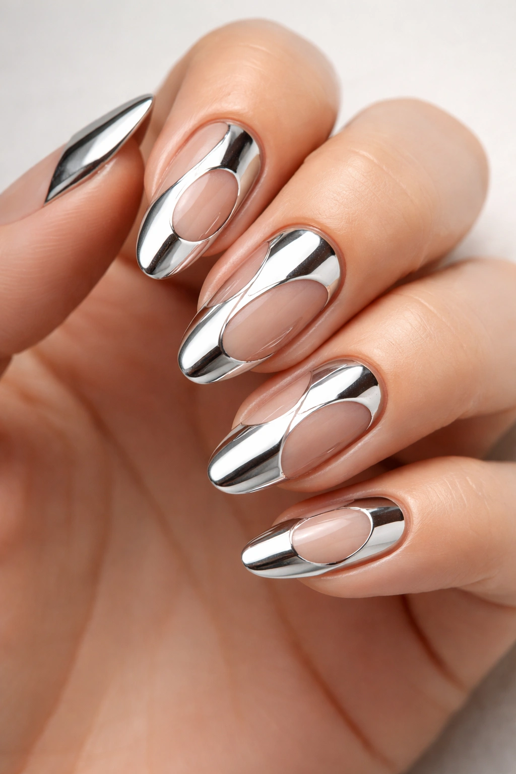 Nails with chrome cutouts leaving natural nail visible