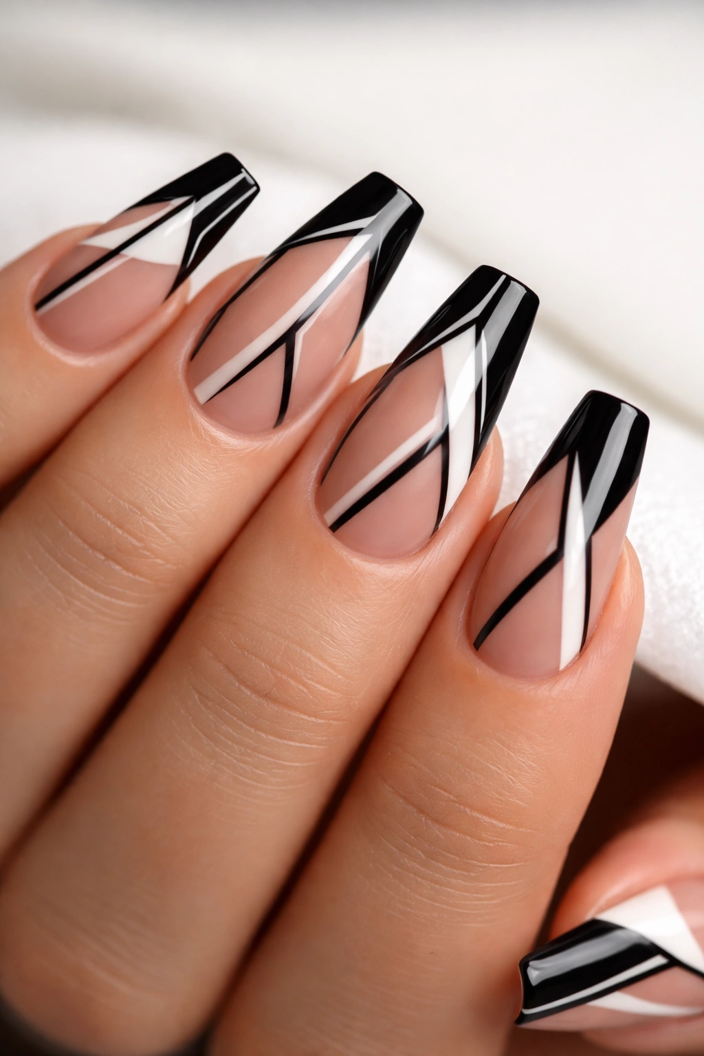 Close-up of negative space geometric lines on coffin nails