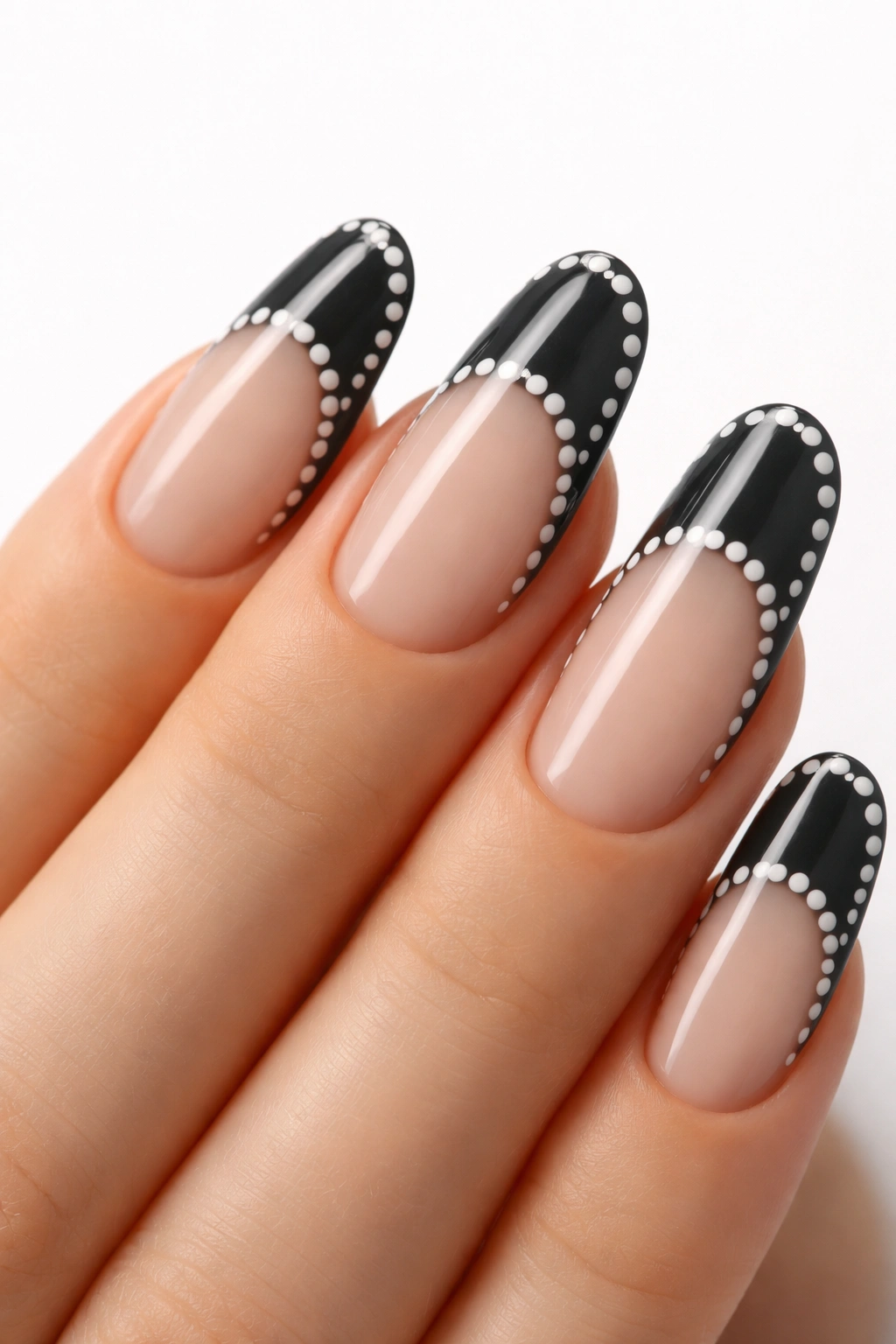 Charcoal nails with white dot outlines creating negative space