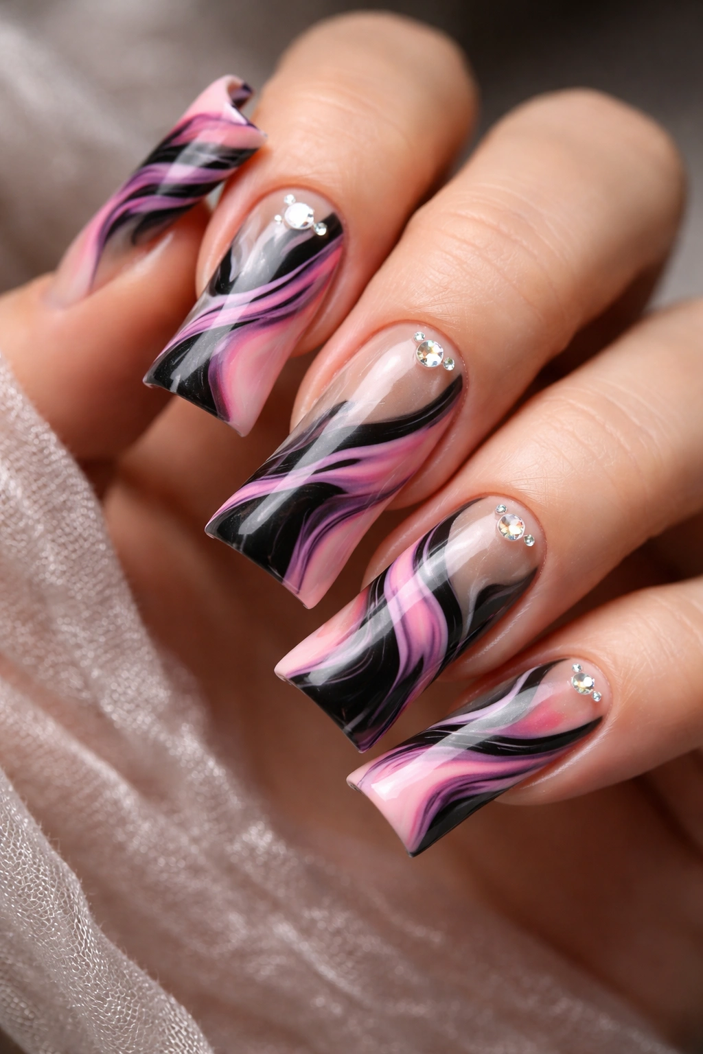 Duck nails featuring black and pink marble with negative space