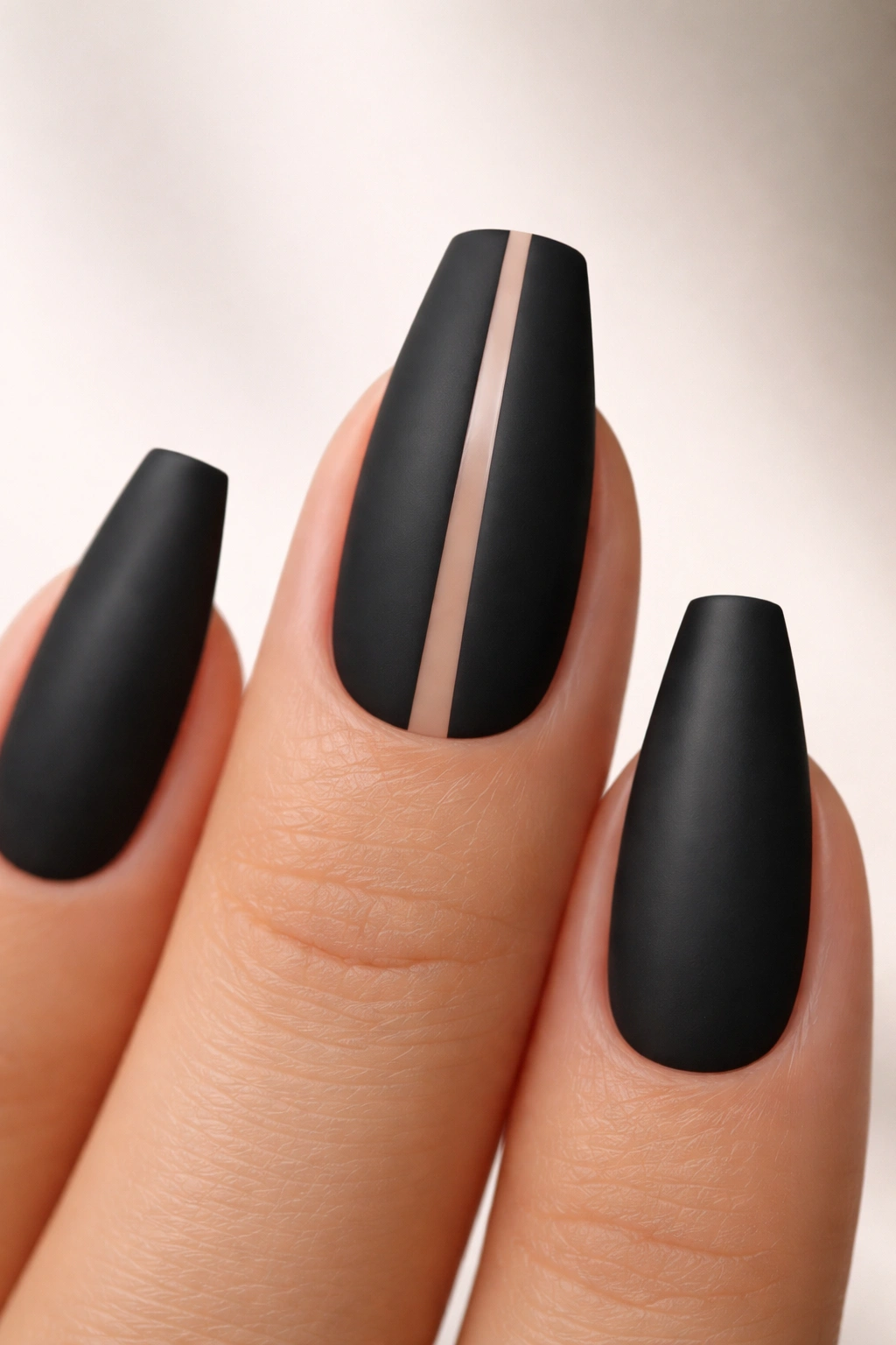 Matte black nail with a tiny center negative space slit.