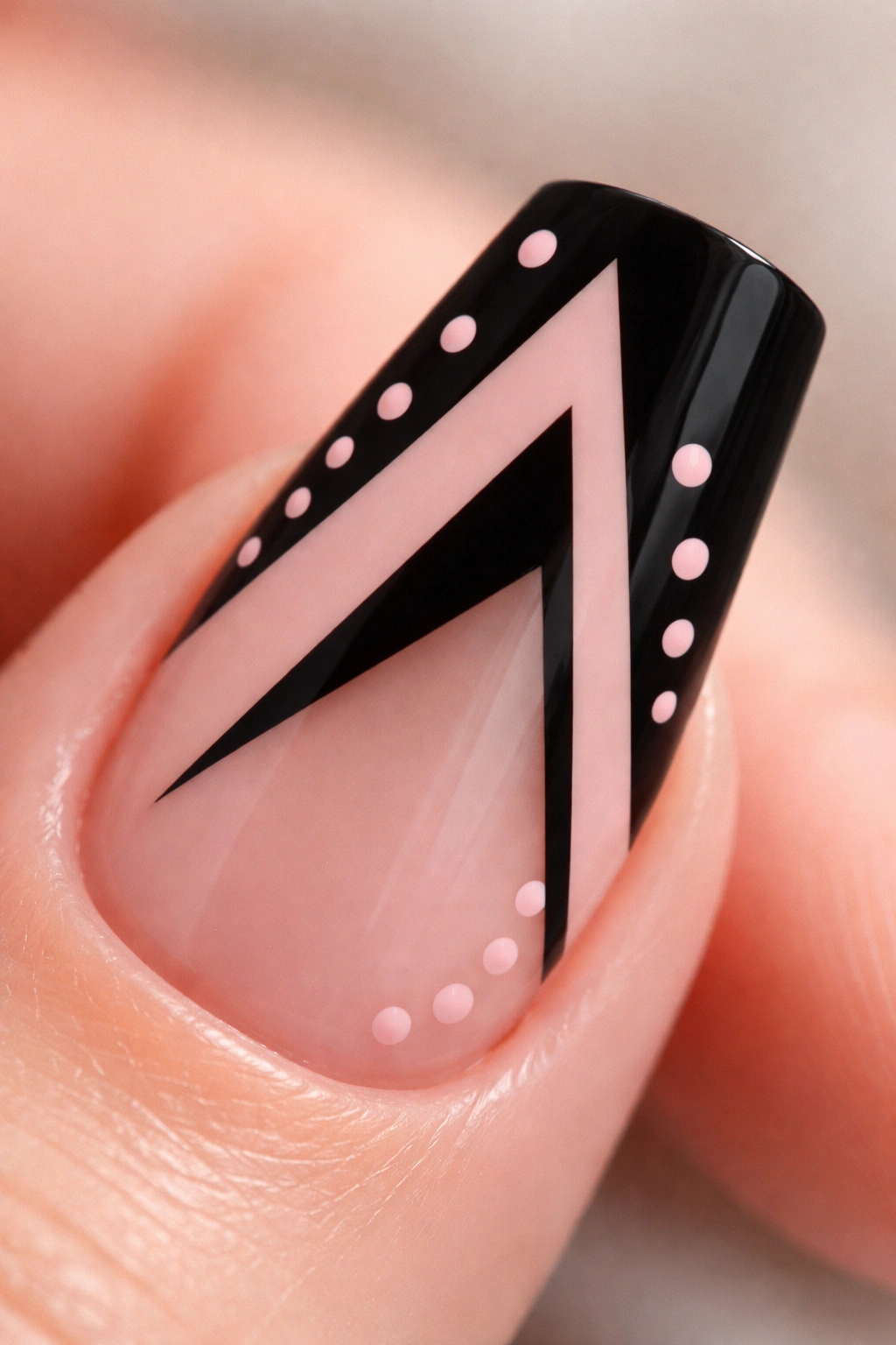 Duck nail featuring negative-space geometric shape and pink dots.