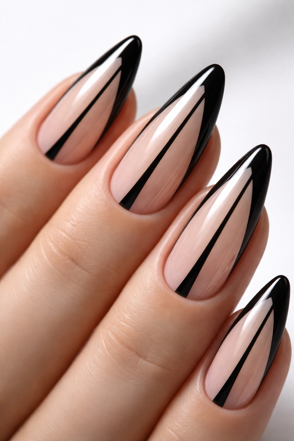 Almond nail with black negative-space line pattern on clear base