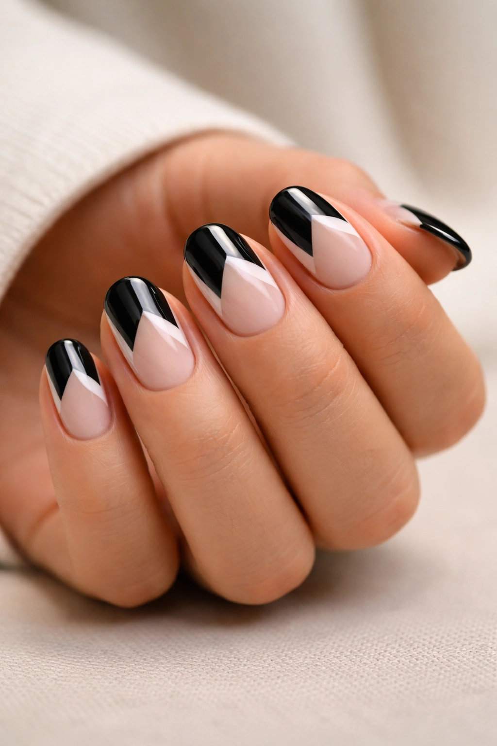 Negative space geometric black French manicure on short almond nails