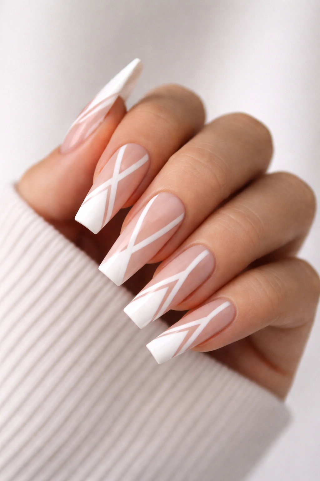 Nude coffin nails with white negative-space geometric design