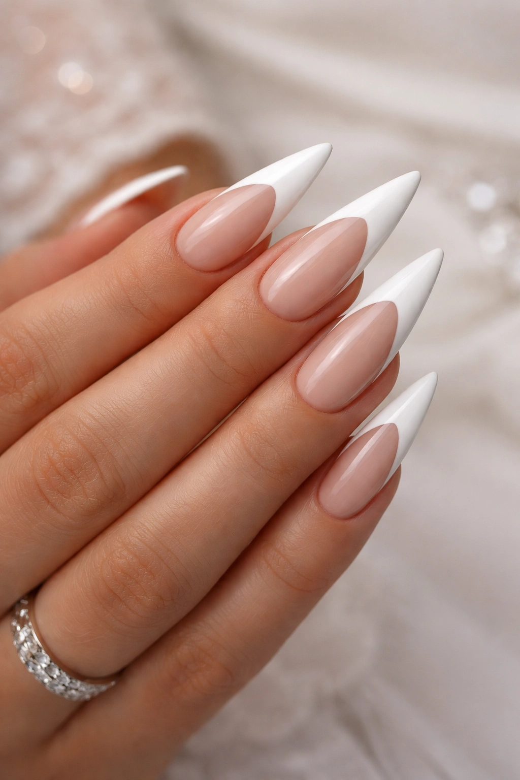White stiletto nails with negative-space tips