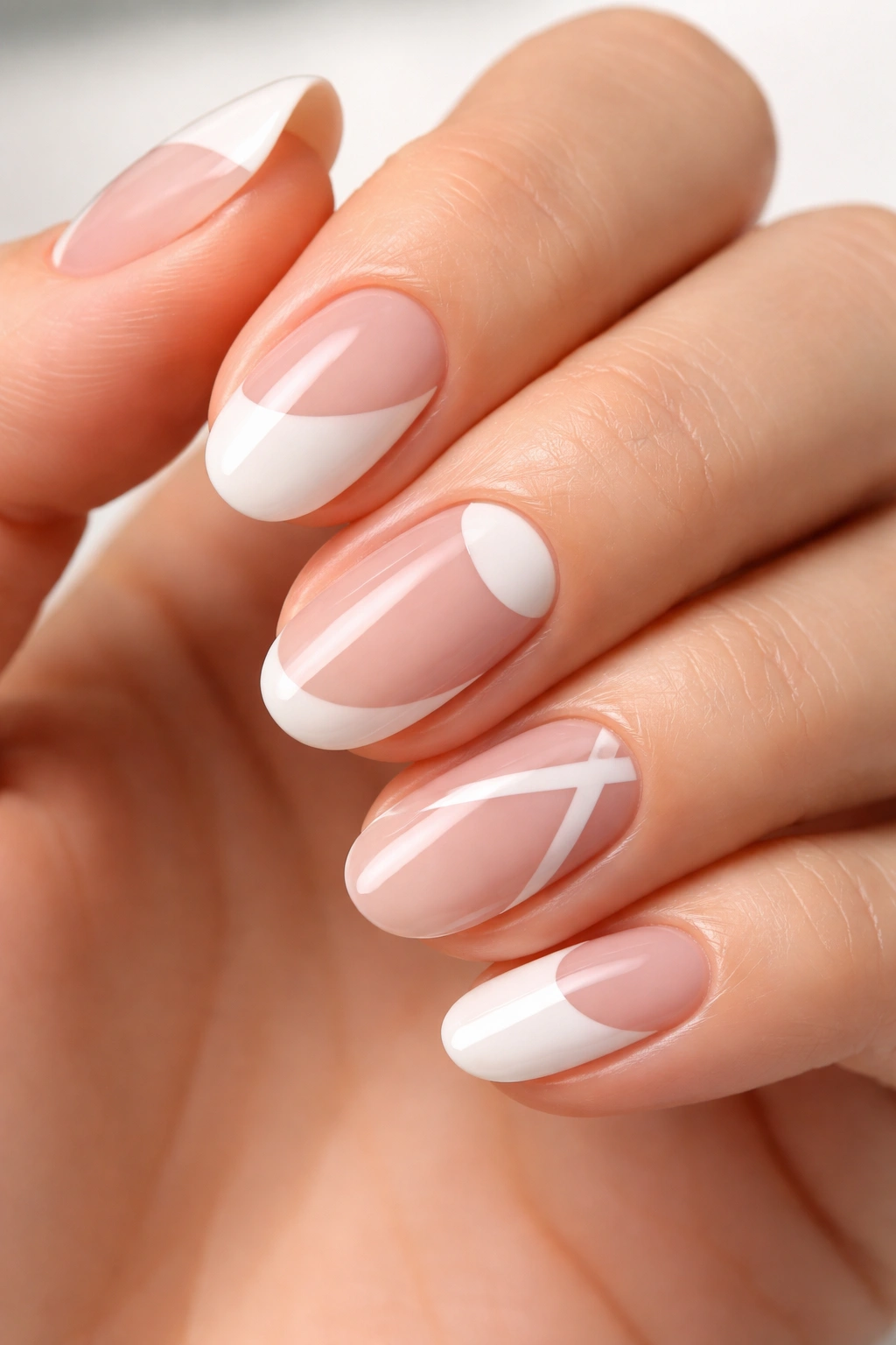 Nails with negative-space geometric patterns and cutouts