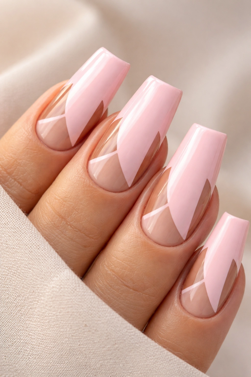 Duck-nail nails with negative-space geometric cutouts on a pink base