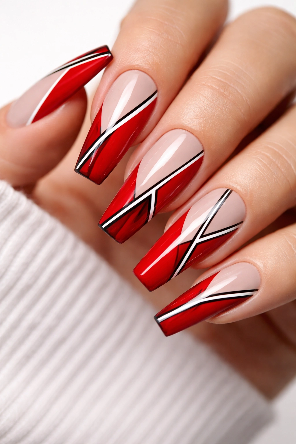 Coffin nails with red sections, bare spaces, and geometric lines.