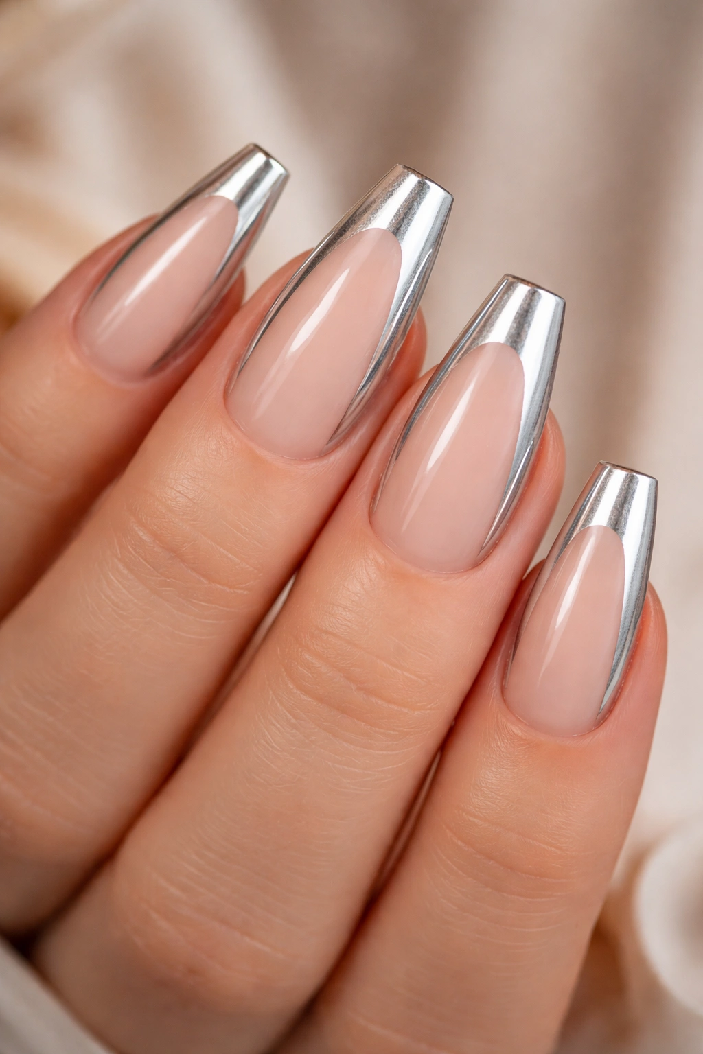 Close up of negative-space nails with bright silver side panels
