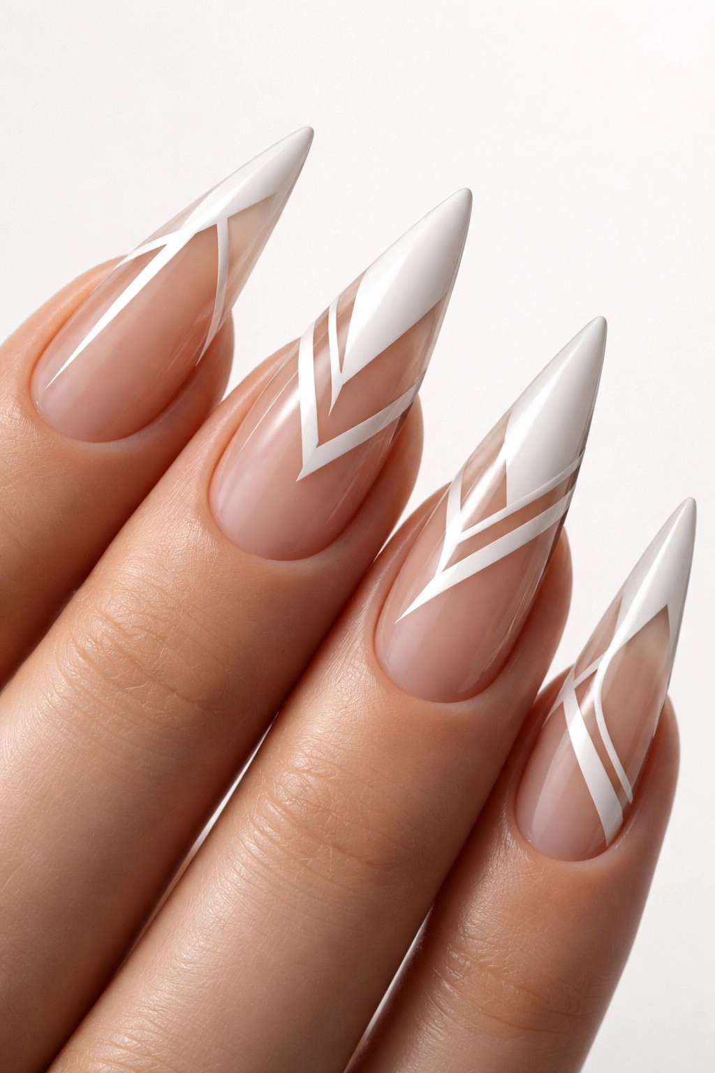 Close-up of negative space stiletto nails with bare sections