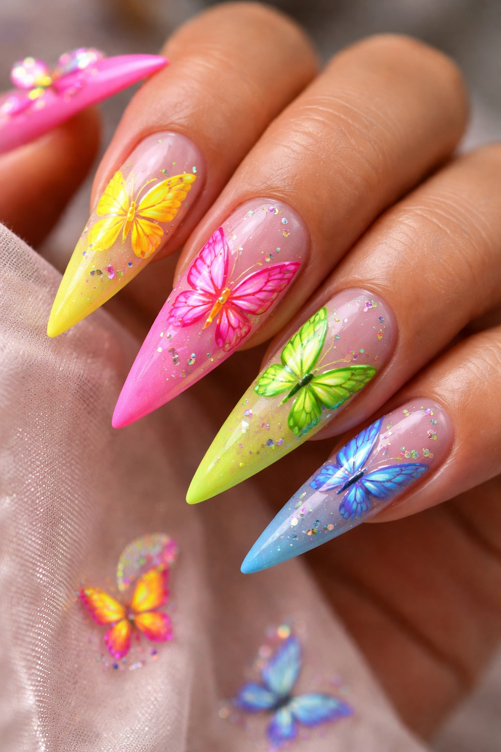 Neon butterfly nail art on stiletto nails