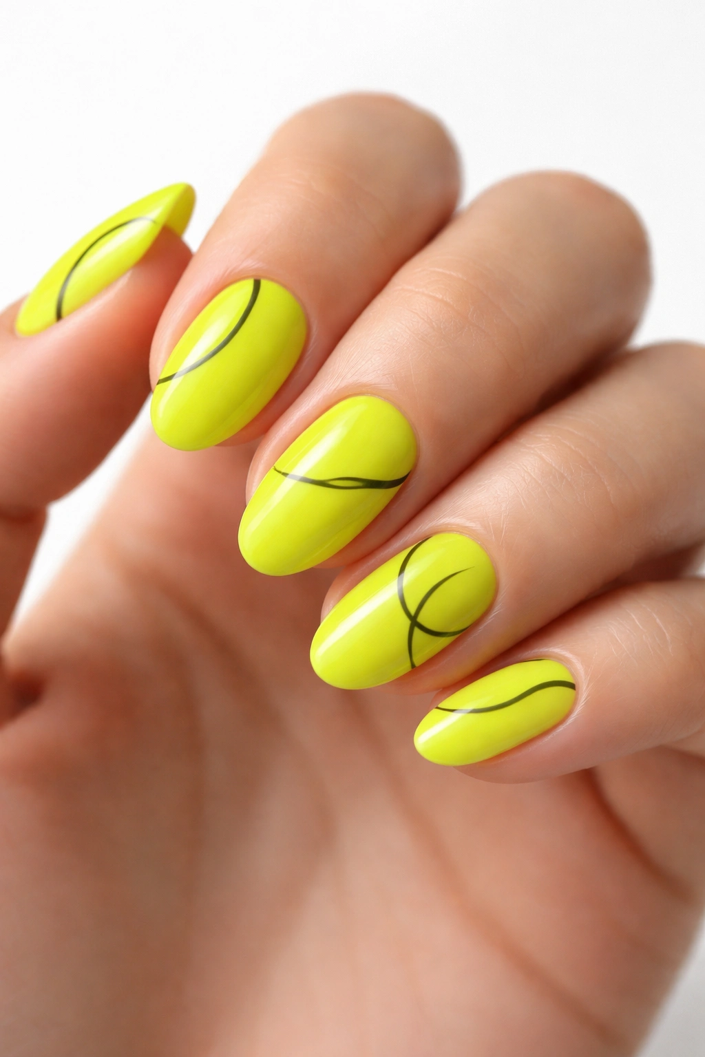 Close-up of neon chartreuse almond nails with minimal black line art