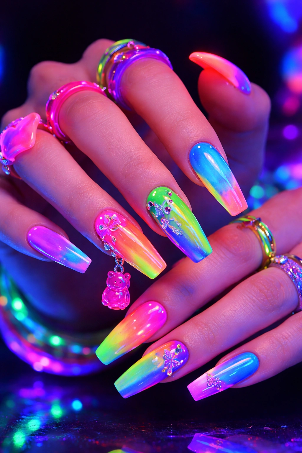 Nails in bright neon shades glowing under blacklight