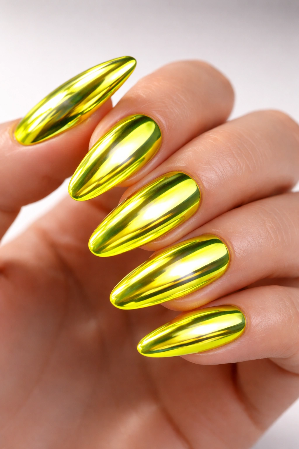 Neon yellow nails with chrome mirror finish