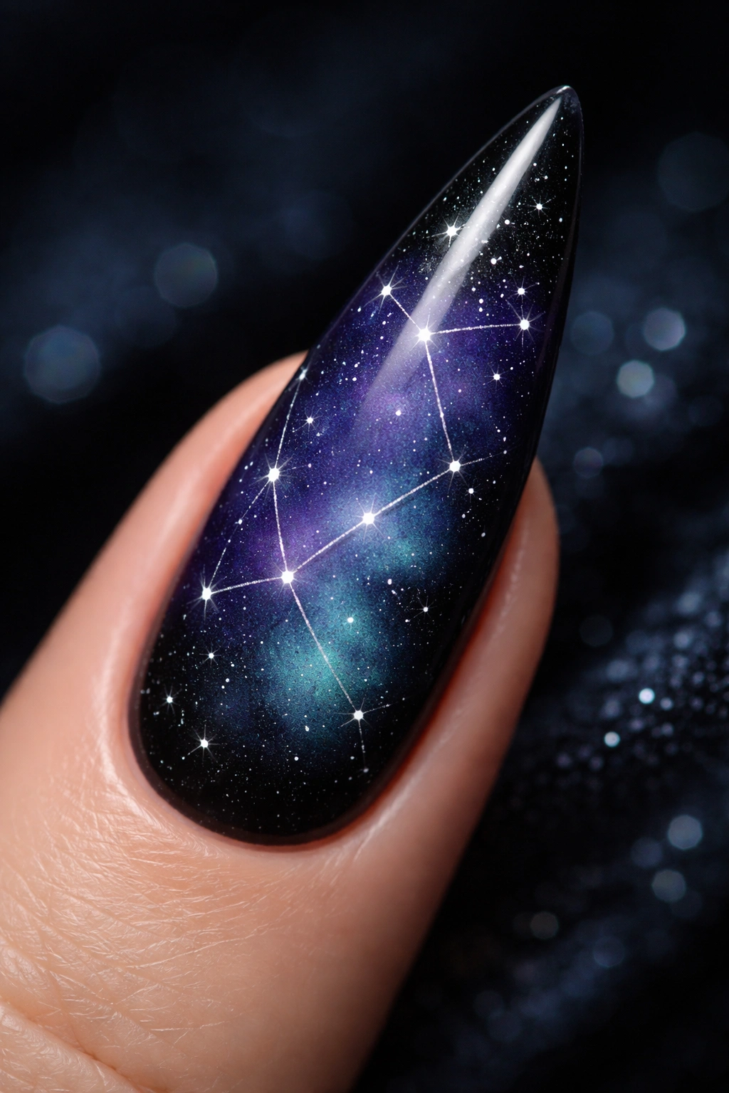 Stiletto nail with night-sky gradient and constellation details