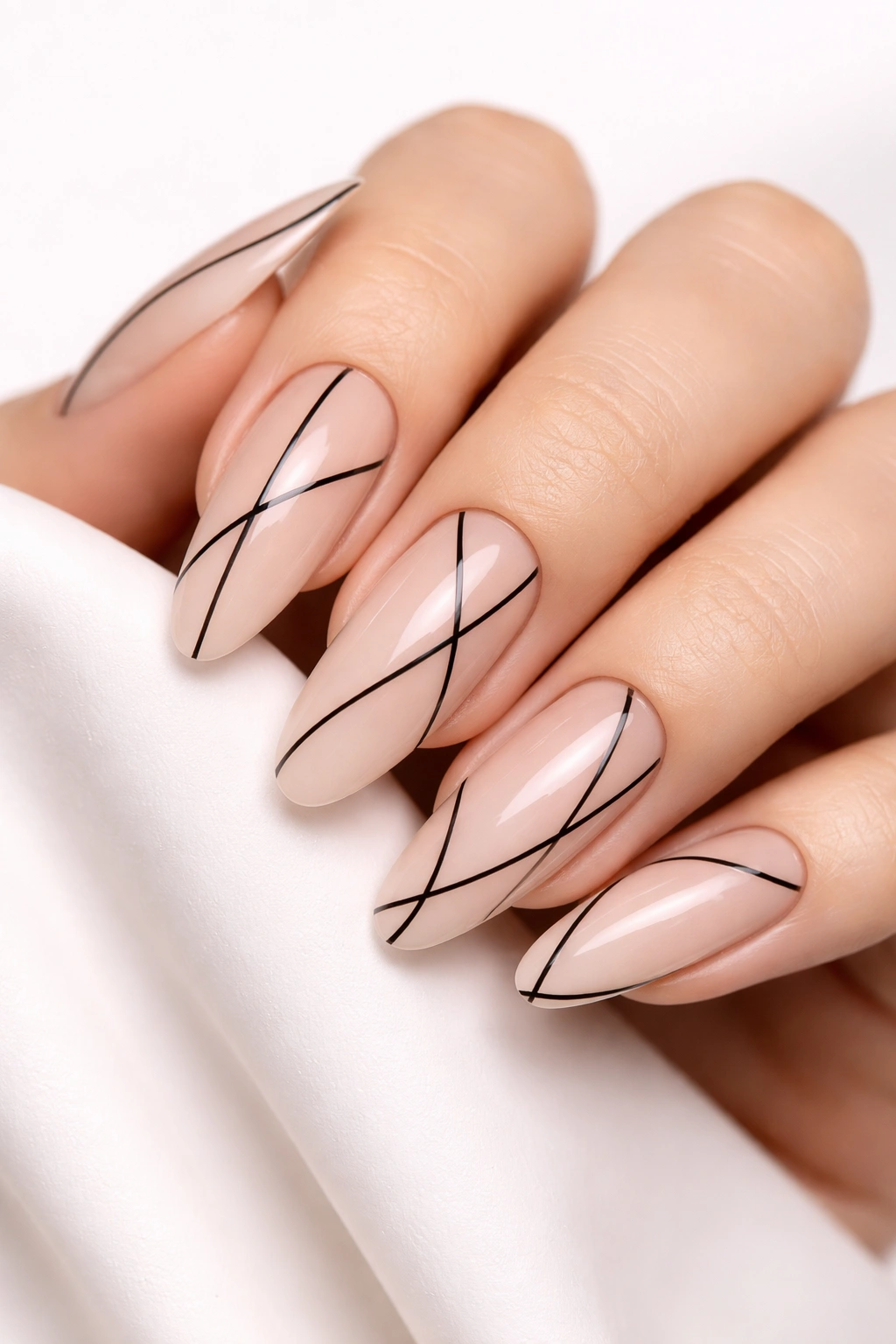 Nude nails with thin black negative-space lines