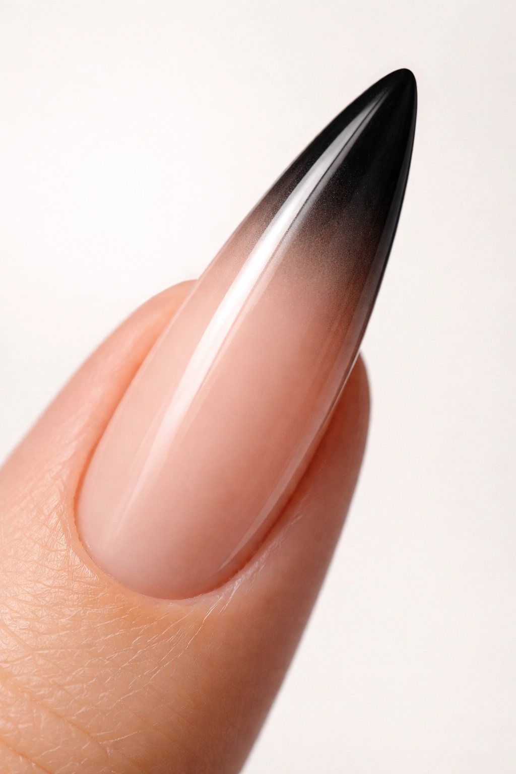 Nude to black gradient on curved stiletto nail