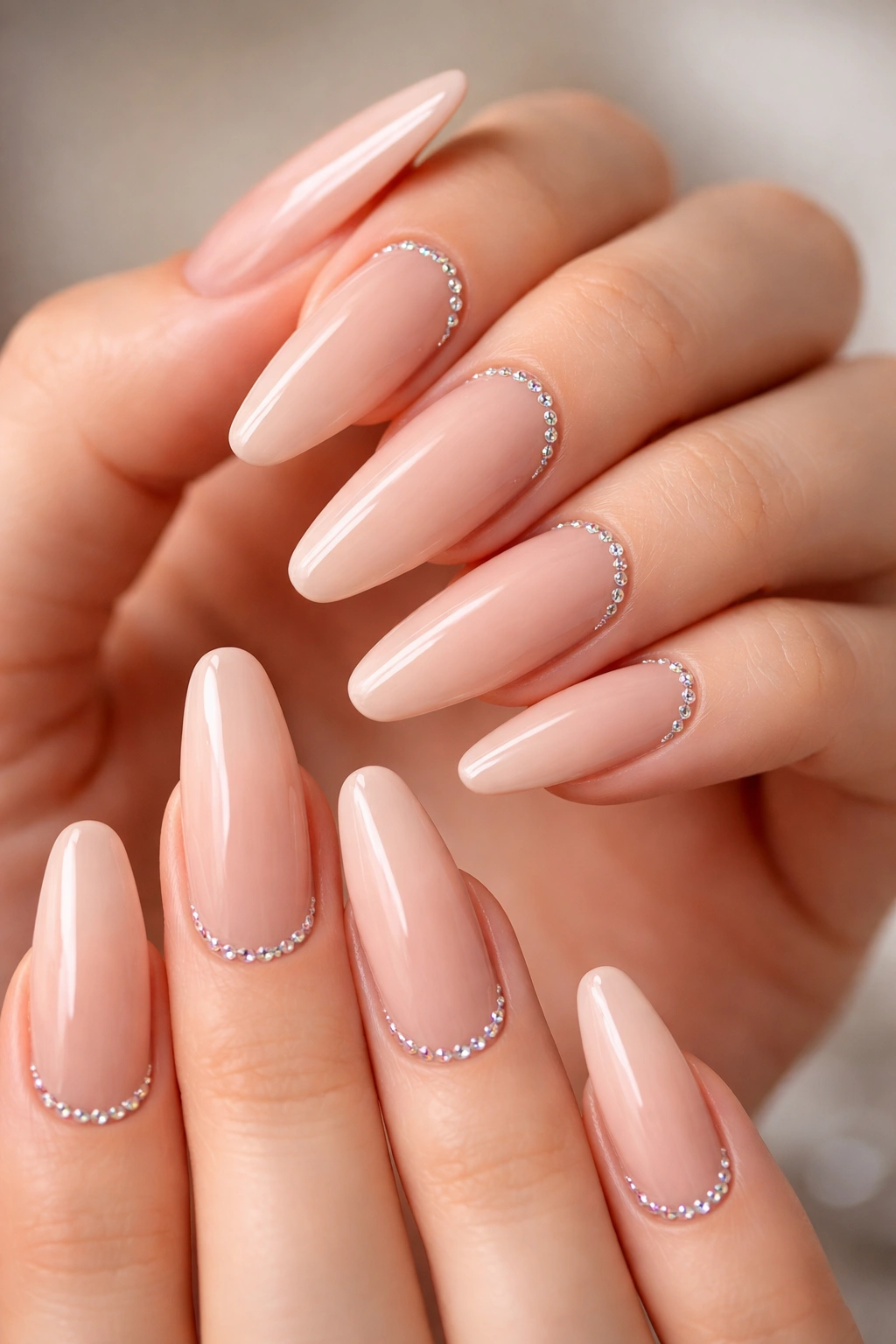 Nude ballerina nails with micro crystals along the cuticle