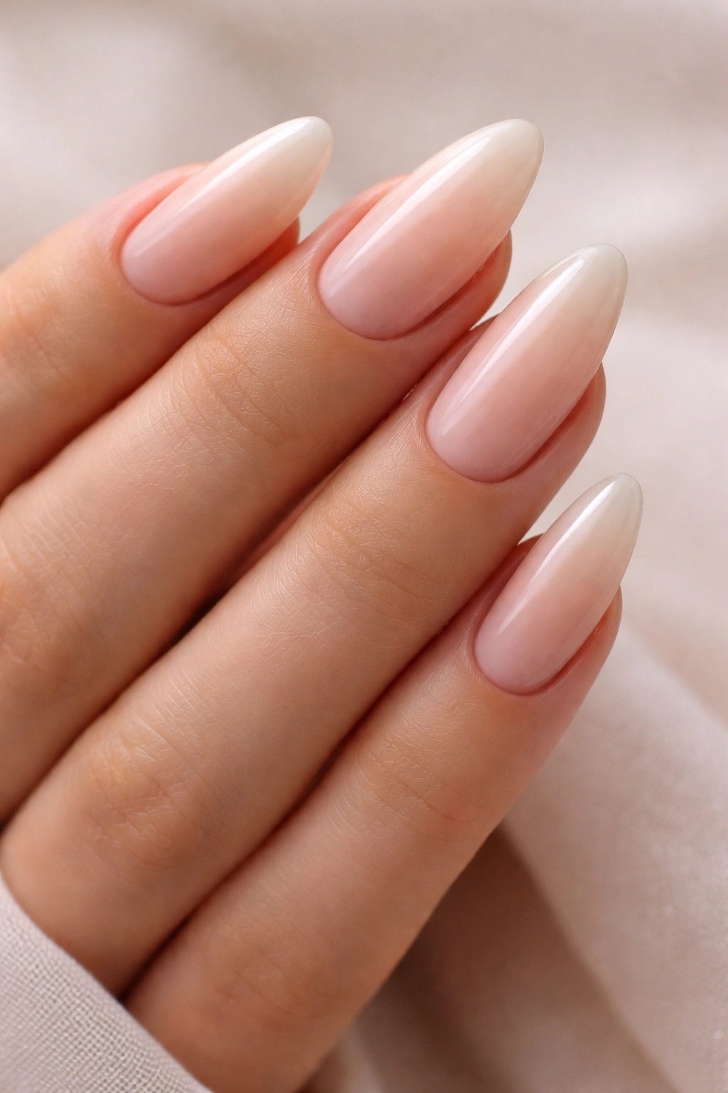 Almond nails with nude beige to pink ombre