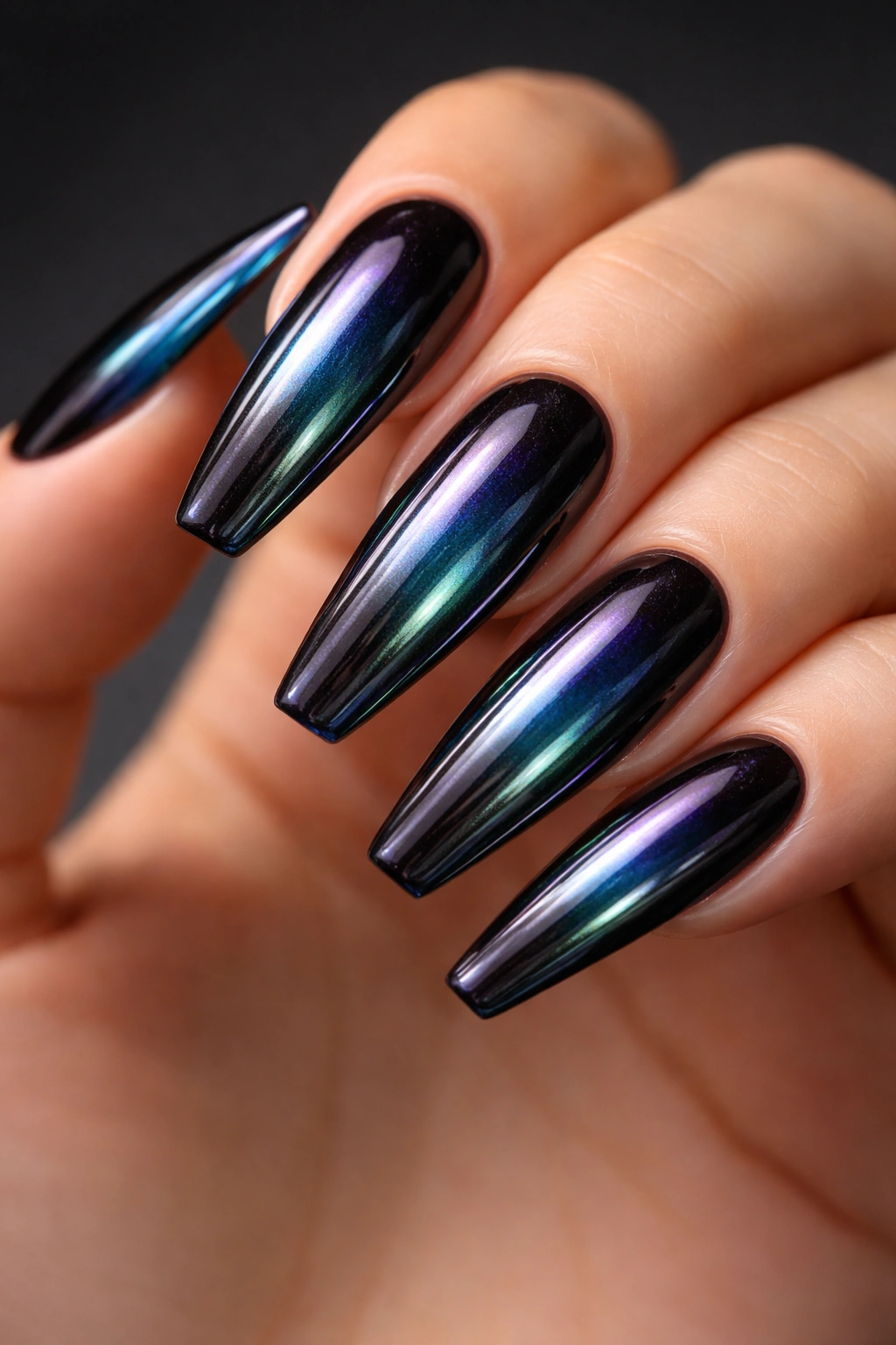 Oil-slick black chrome ballerina nails with color-shifting reflections