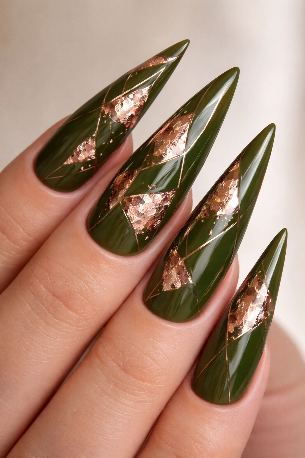 Olive green stiletto with rose gold foil geometric shapes close-up