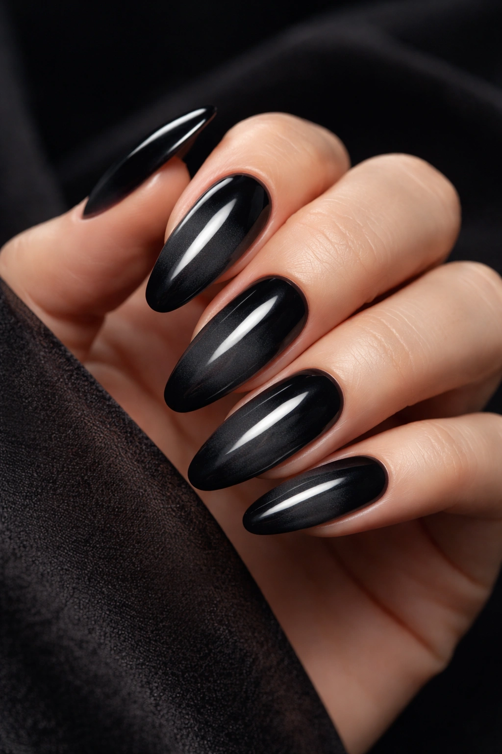 Nails with a smooth black to charcoal ombré gradient