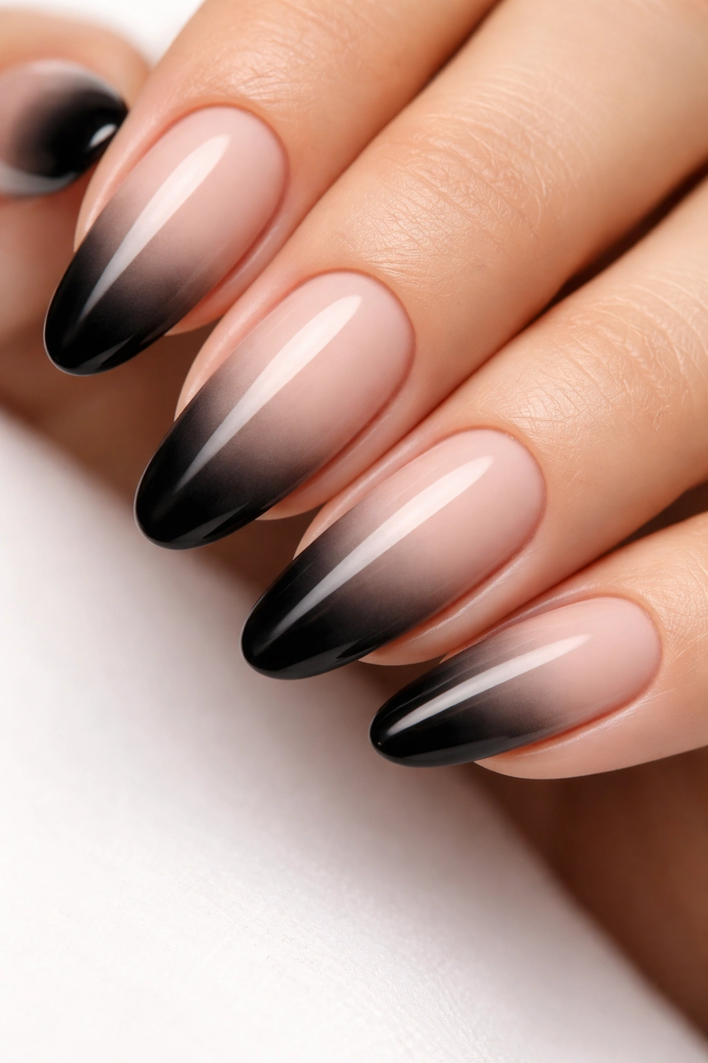 Close-up of nails with black ombre French tips