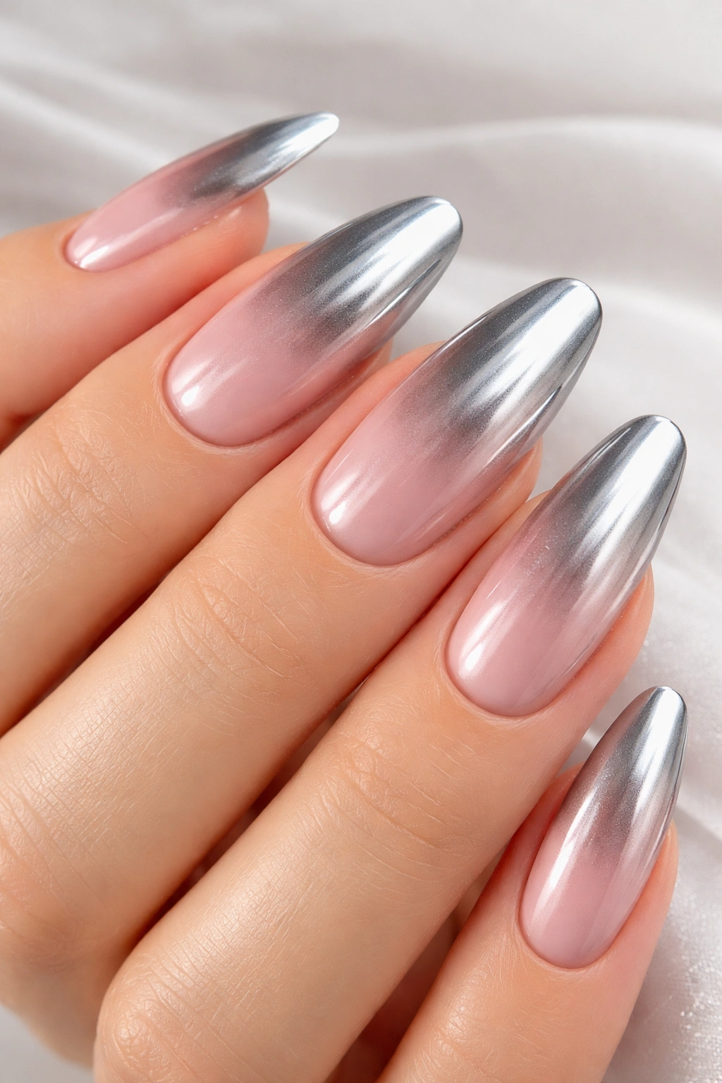 Nails with silver chrome gradient fading into pink