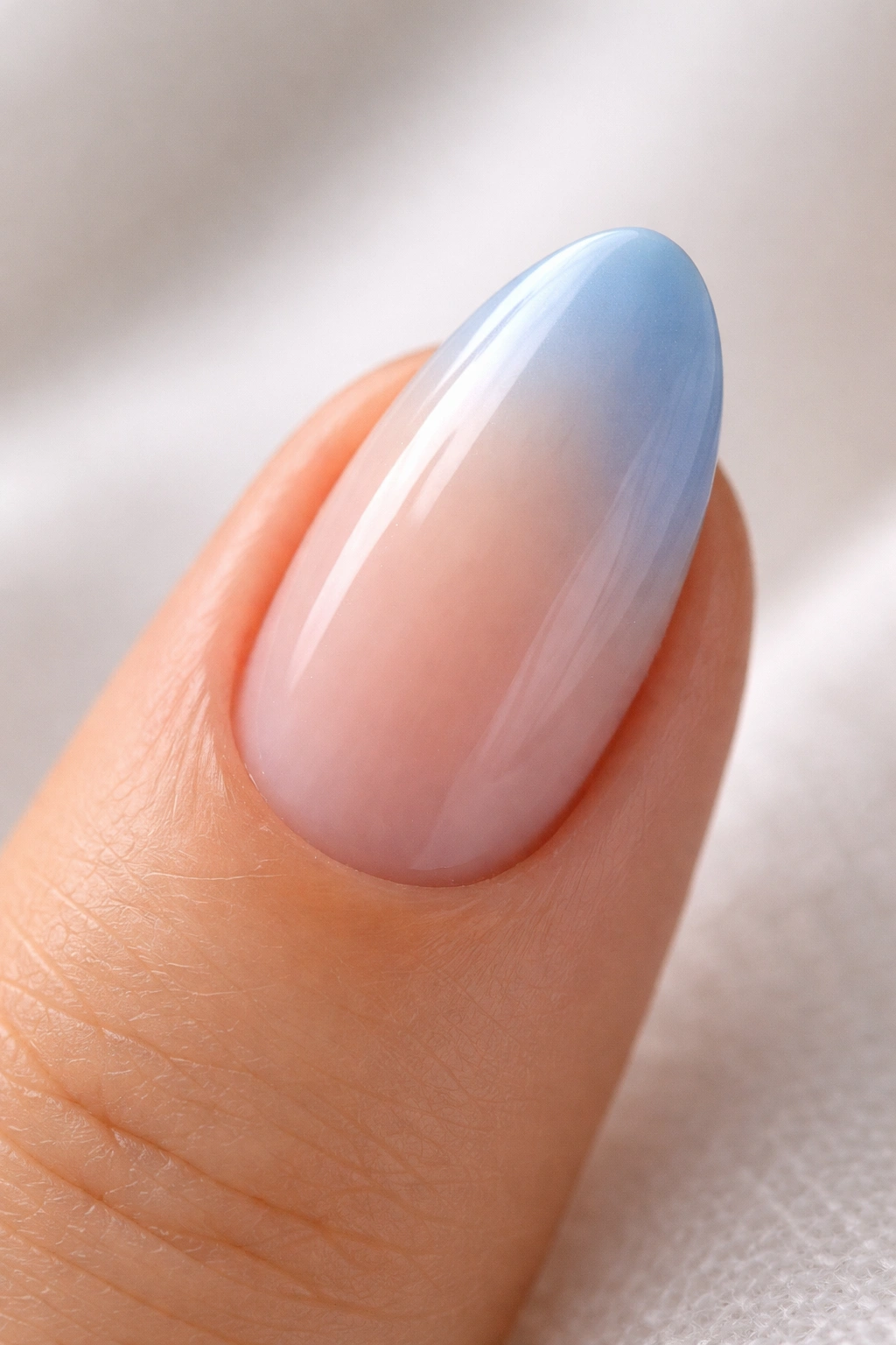 Short almond nail with soft blue ombre tip