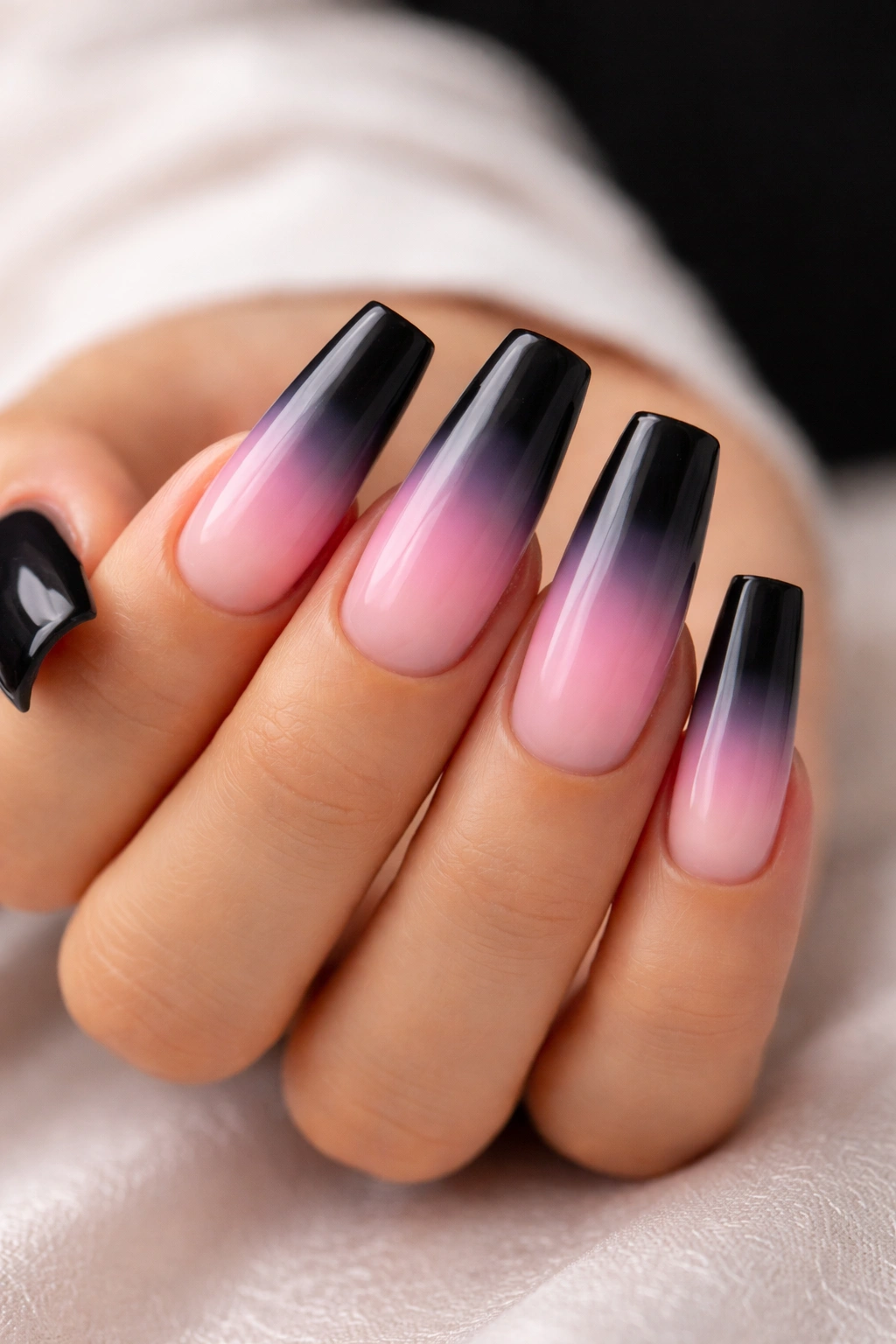 Duck nails with a smooth black to pink gradient