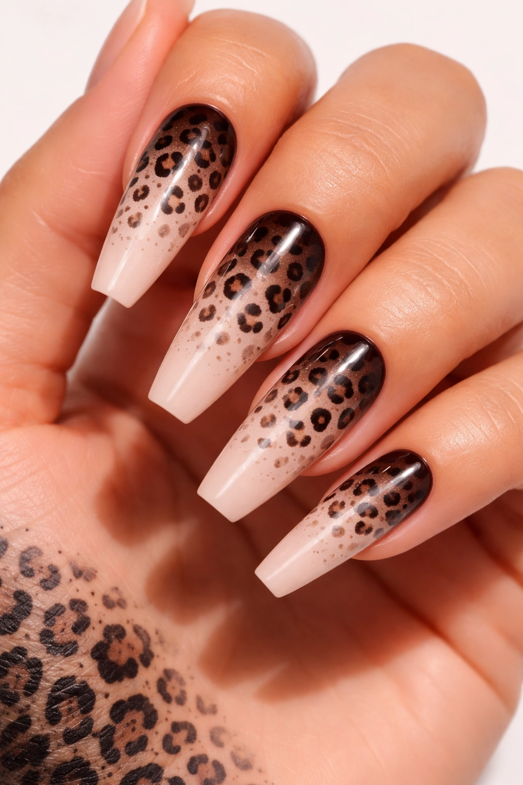 Long nails with ombre leopard fade from dark to light and scattered spots
