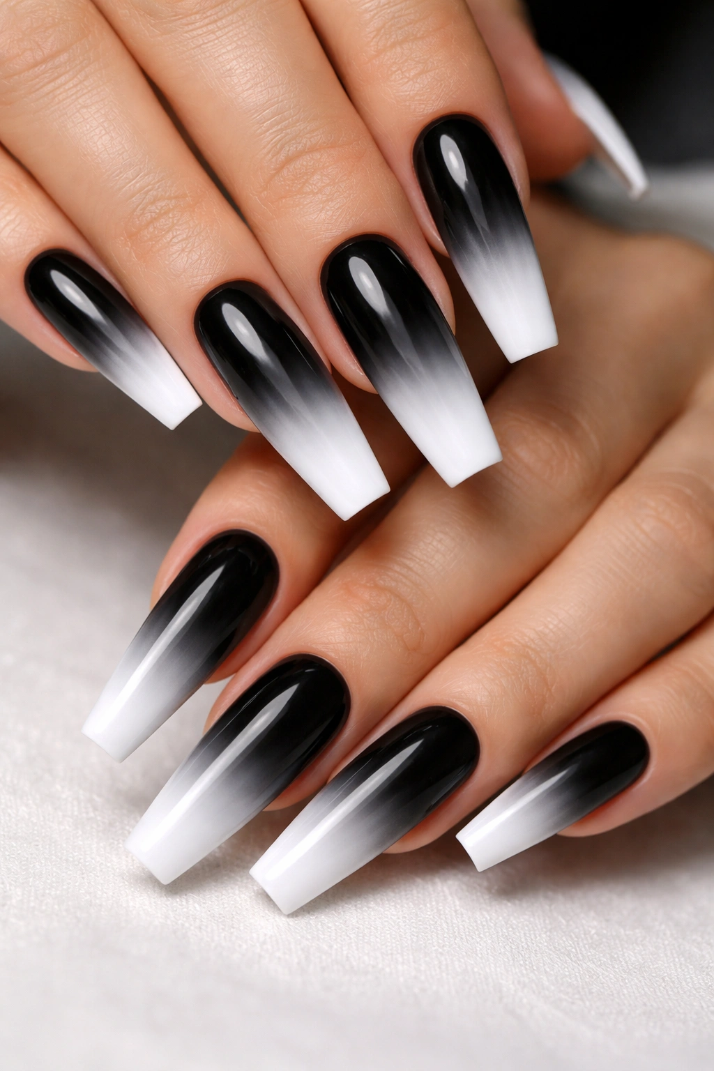 Close-up of coffin nails with black-to-white gradient
