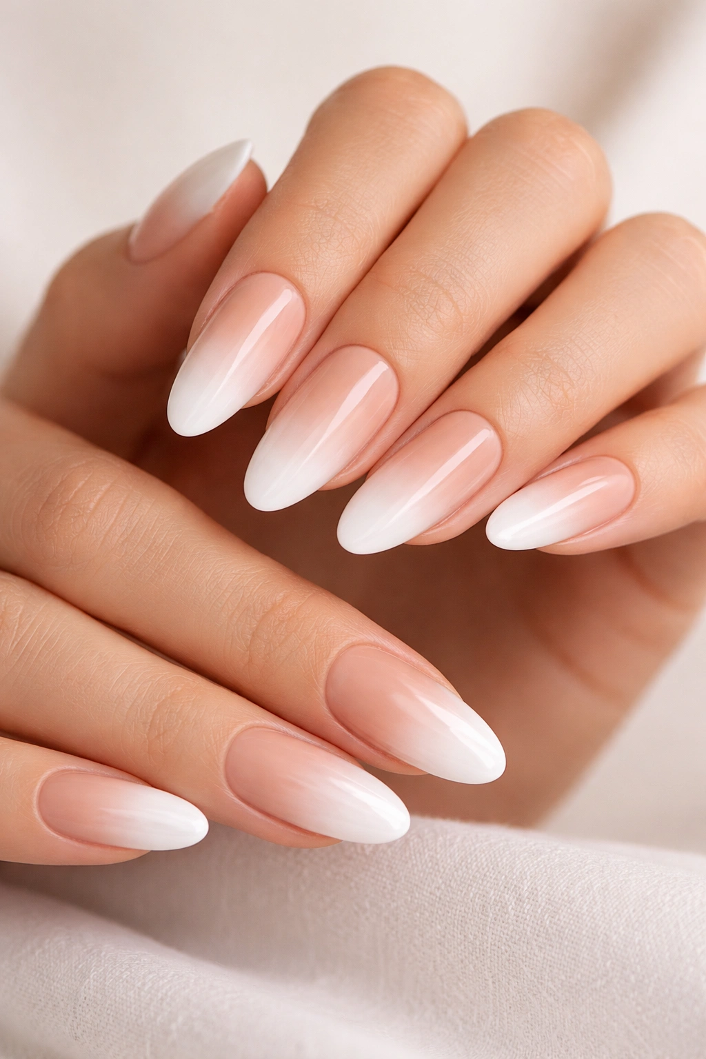 Close-up of nude-to-white ombré on long oval nails