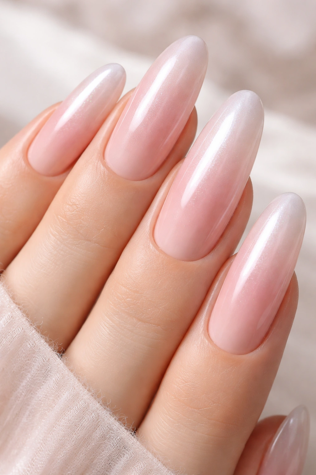 Soft blush ombre nails with pearl finish on long rounds