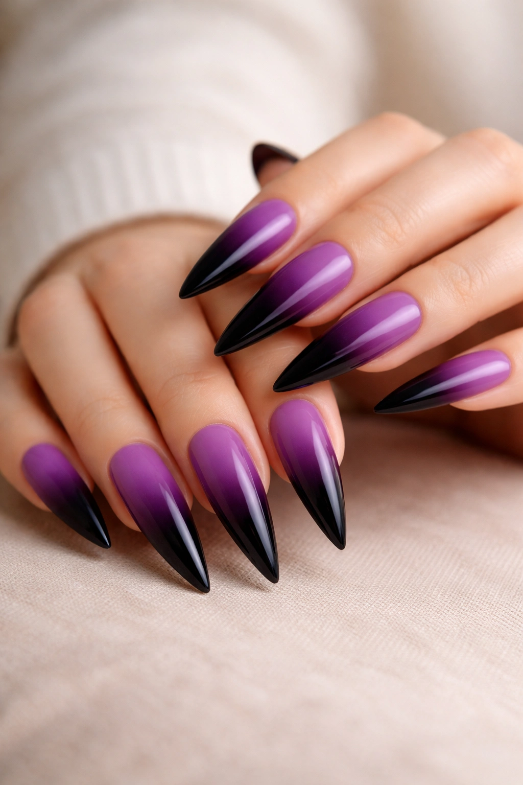 Ombré purple to black gradient on stiletto nails