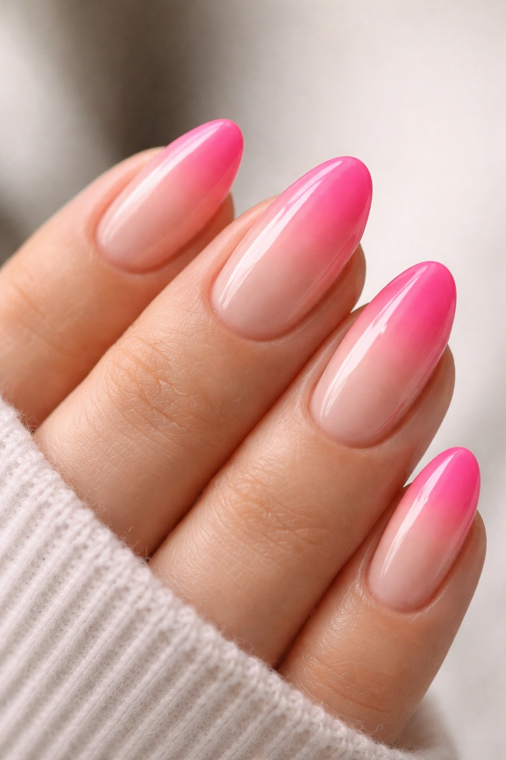 Ombré hot pink french tip on a short almond nail