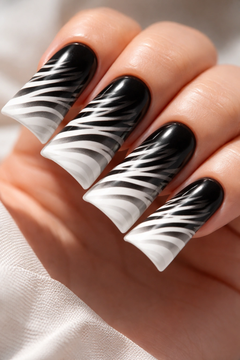 Ombre black-to-white zebra gradient on duck nails